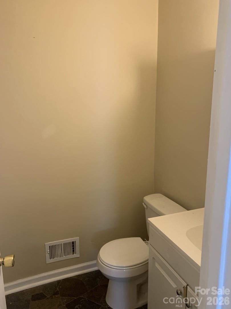 436 Green Tree Circle Columbia, SC 29203 - Photo 7 of 12 a white toilet sitting next to a white wall