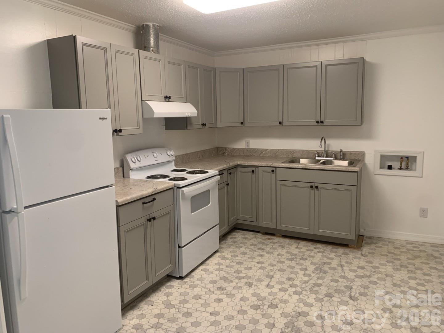 436 Green Tree Circle Columbia, SC 29203 - Photo 8 of 12 a kitchen with a sink a refrigerator and cabinets