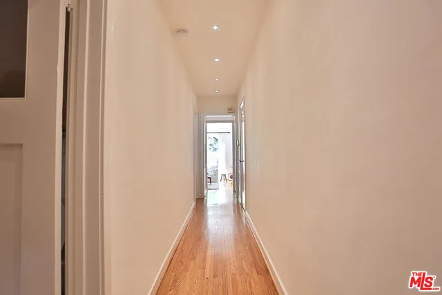 a view of a hallway with washer and dryer
