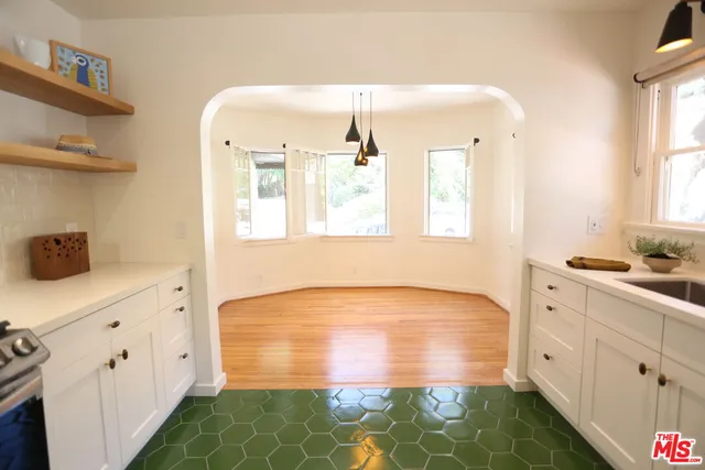 a bathroom with a double vanity sink and mirror