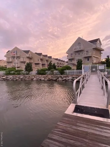 a view of a lake with a house in the background