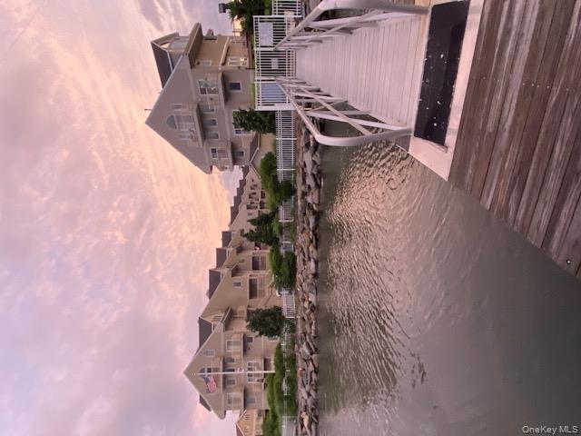 a view of a lake with a house in the background