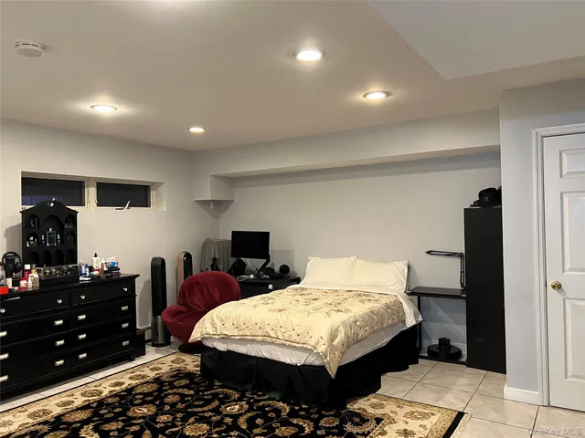 a bedroom with a bed and a furniture