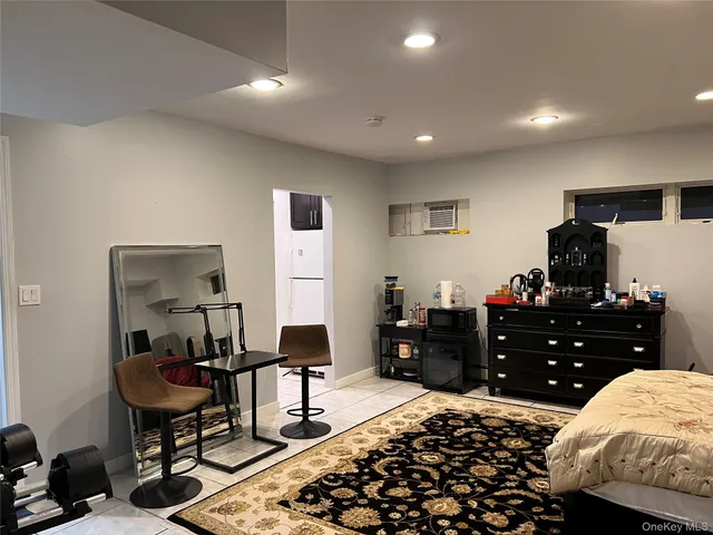 a bedroom with a bed and a table in it