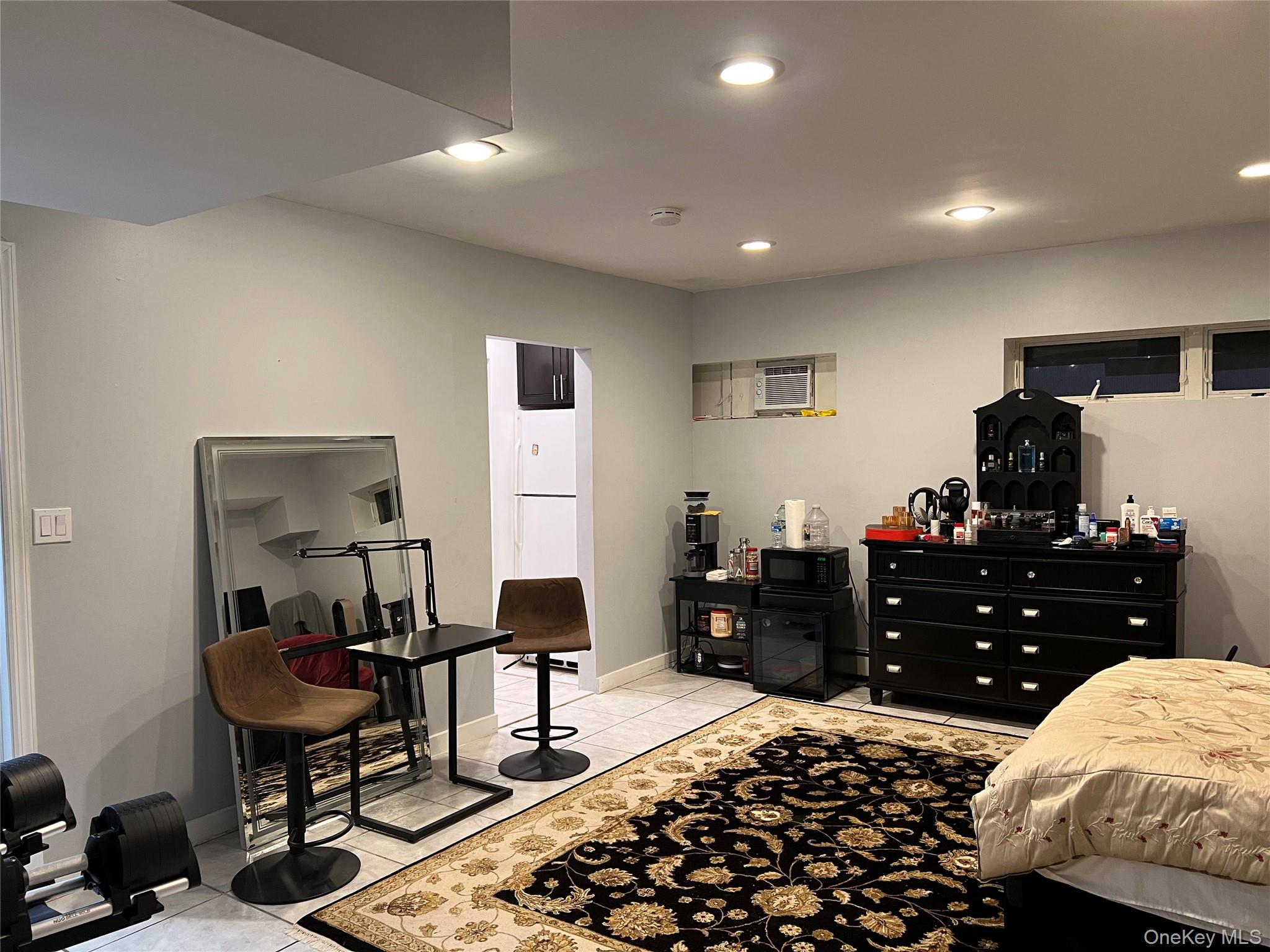 204 Outlook Avenue Bronx, NY 10465 - Photo 12 of 12 a bedroom with a bed and a table in it