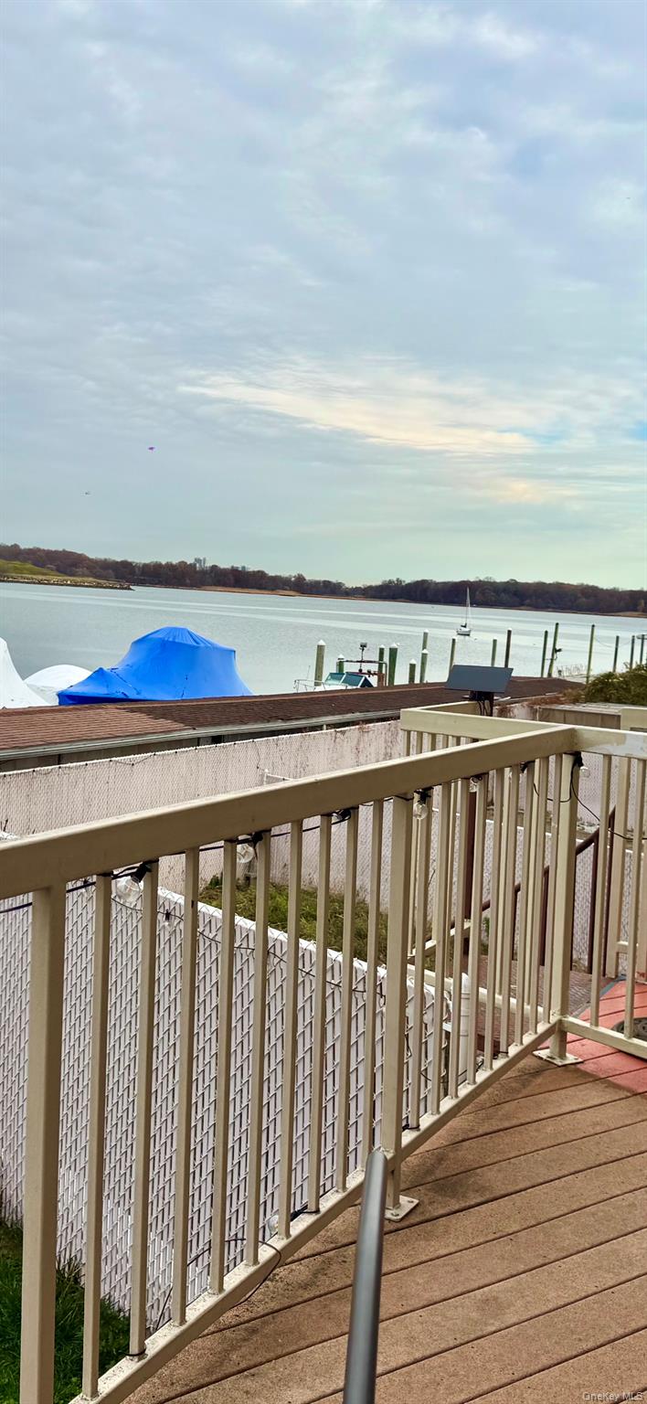 204 Outlook Avenue Bronx, NY 10465 - Photo 4 of 12 a balcony with wooden floor and city view