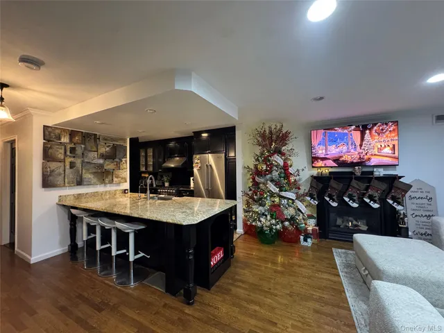 a view of a dining room with furniture wooden floor and chandelier