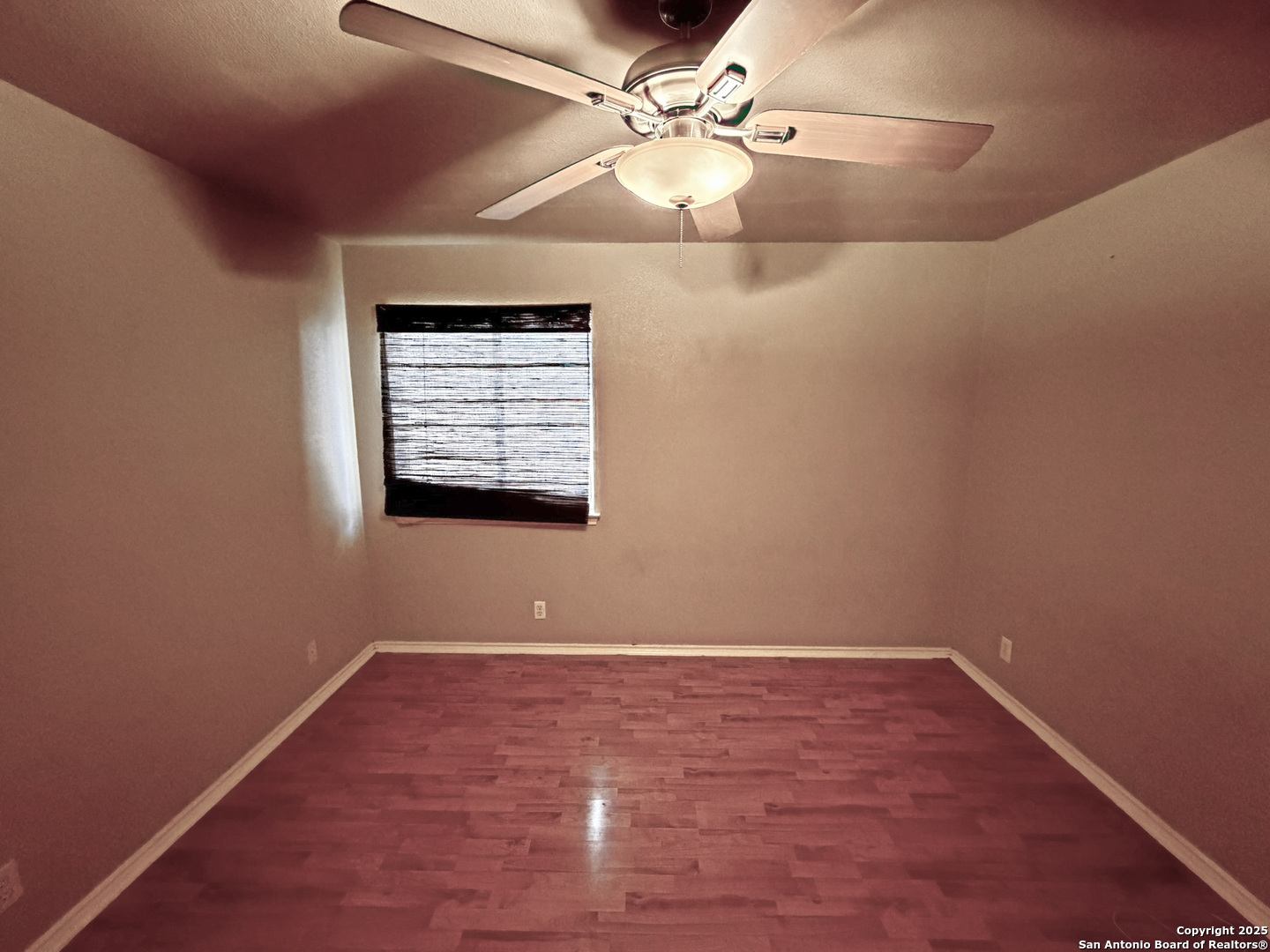 9626 Anderson Way Converse, TX 78109 - Photo 11 of 17 wooden floor in an empty room with a window