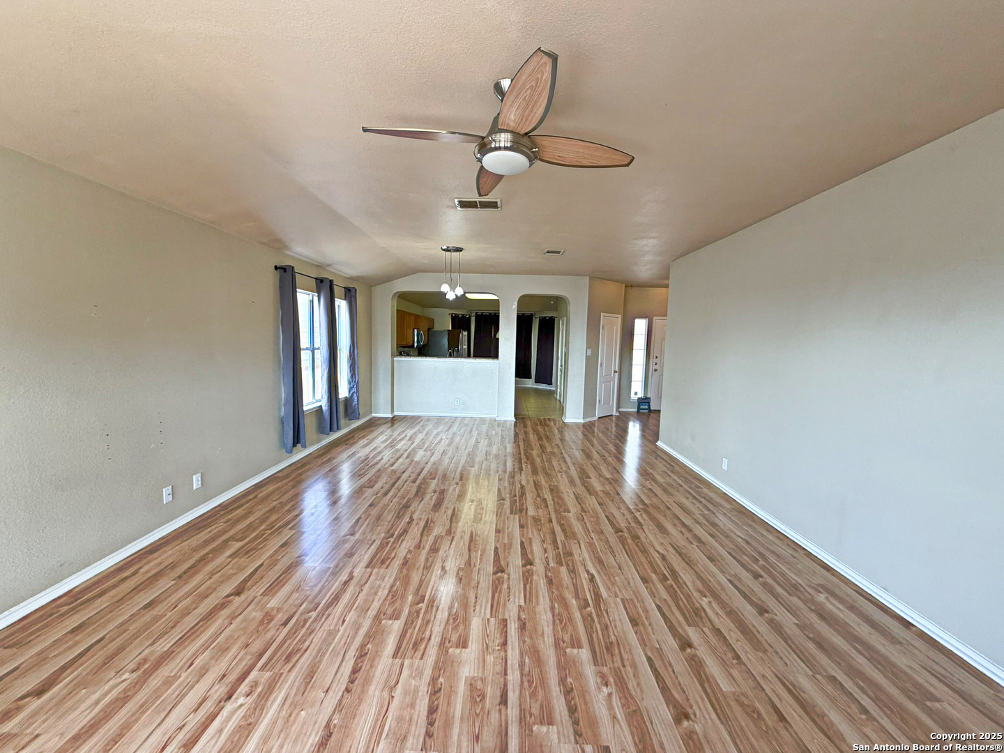 9626 Anderson Way Converse, TX 78109 - Photo 5 of 17 a view of a room with wooden floor and ceiling fan