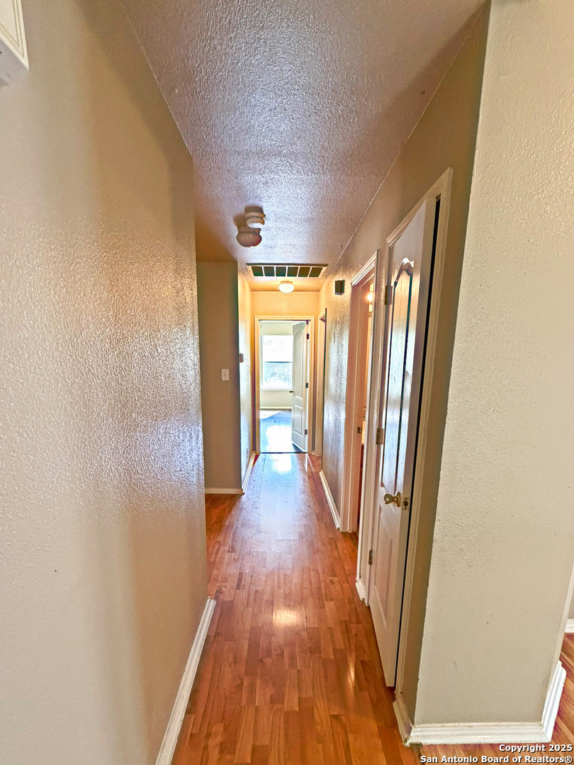 9626 Anderson Way Converse, TX 78109 - Photo 7 of 17 a view of entryway with wooden floor