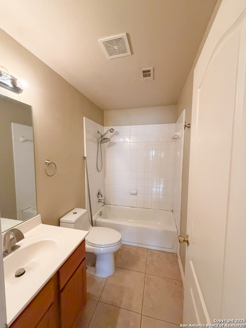 9626 Anderson Way Converse, TX 78109 - Photo 8 of 17 a bathroom with a sink a toilet and shower