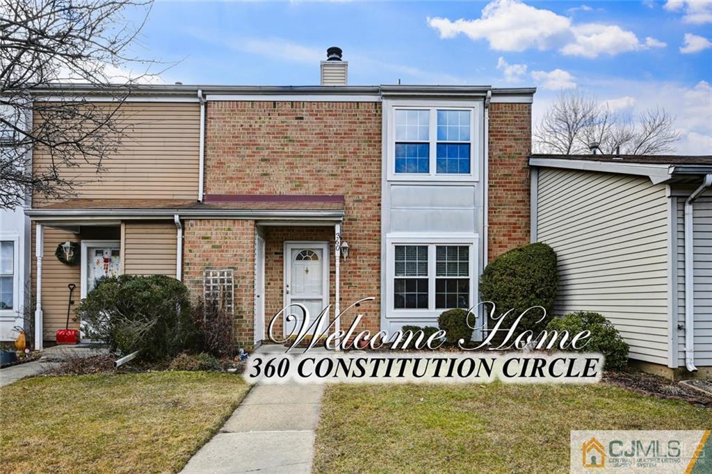360 Constitution Circle North Brunswick, NJ 08902 - Photo 1 of 21 a front view of a house with garden