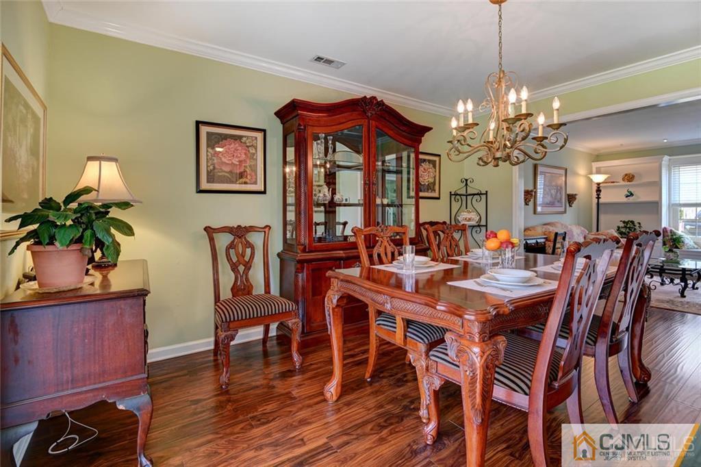 360 Constitution Circle North Brunswick, NJ 08902 - Photo 11 of 21 a view of a dining room with furniture window and wooden floor