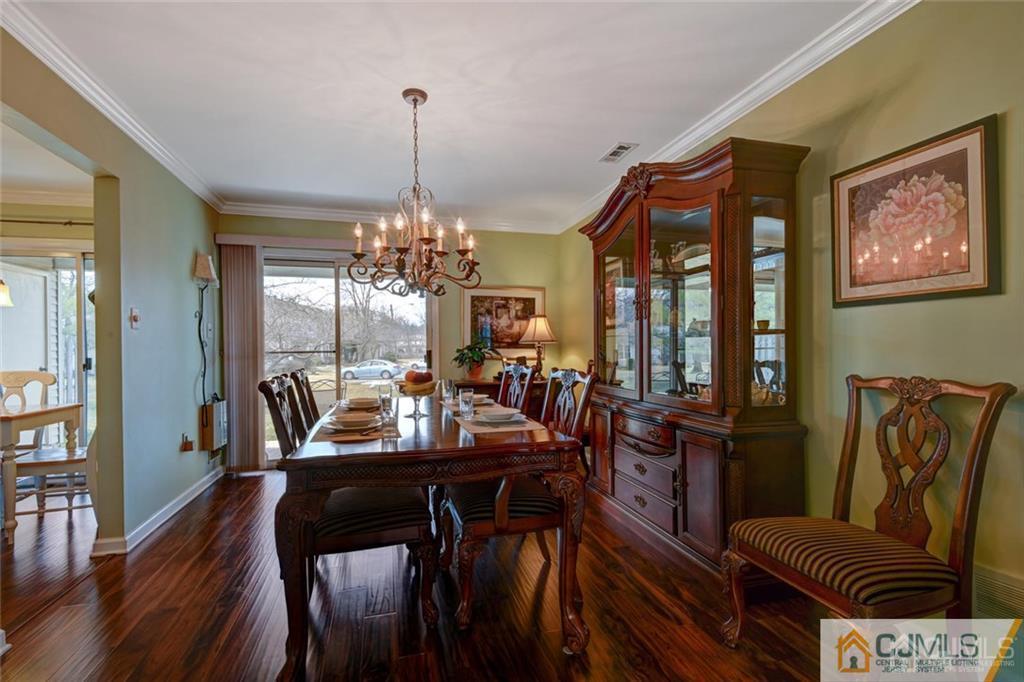 360 Constitution Circle North Brunswick, NJ 08902 - Photo 12 of 21 a view of a dining room with furniture window and wooden floor