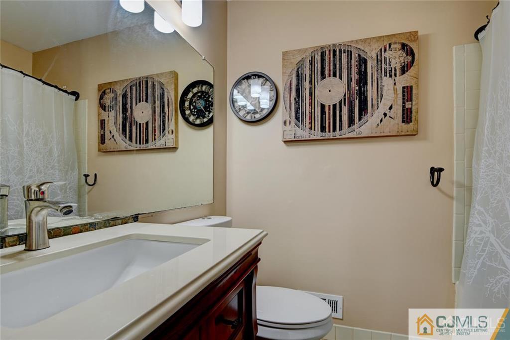 360 Constitution Circle North Brunswick, NJ 08902 - Photo 20 of 21 a bathroom with a toilet and a sink