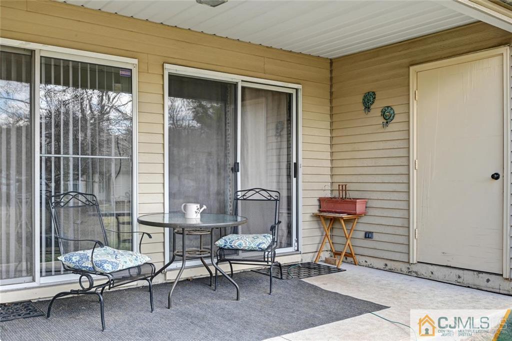 360 Constitution Circle North Brunswick, NJ 08902 - Photo 21 of 21 a outdoor space with a couch and a potted plant
