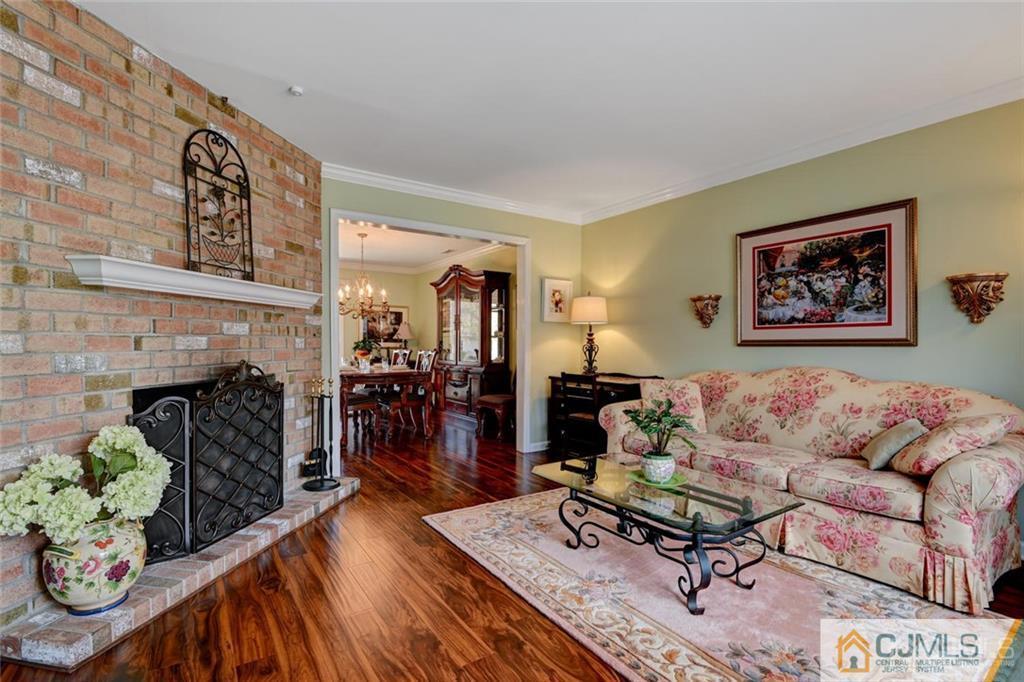 360 Constitution Circle North Brunswick, NJ 08902 - Photo 9 of 21 a living room with furniture and a fireplace