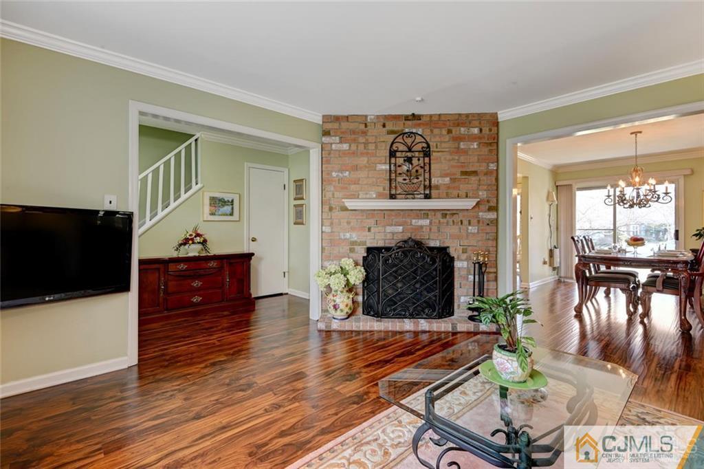 360 Constitution Circle North Brunswick, NJ 08902 - Photo 10 of 21 a living room with furniture and a fireplace