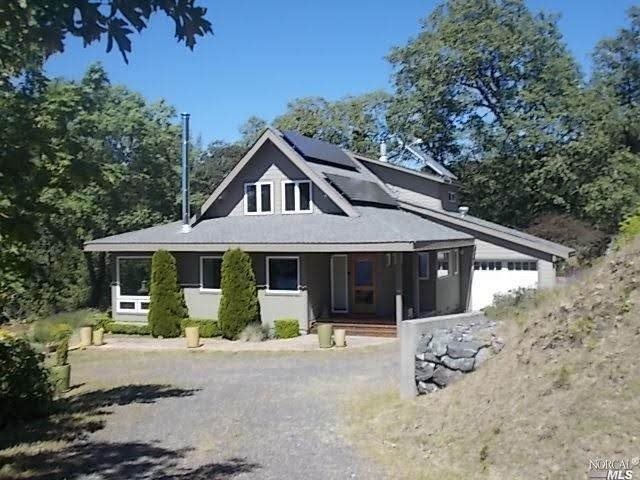6000 Ridge Ranch Road Willits, CA 95490 - Photo 1 of 1 a front view of a house with garden