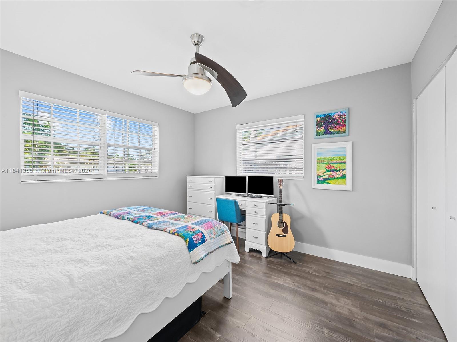 3904 Arthur Street Hollywood, FL 33021 - Photo 17 of 32 a bedroom with a bed a window and dresser