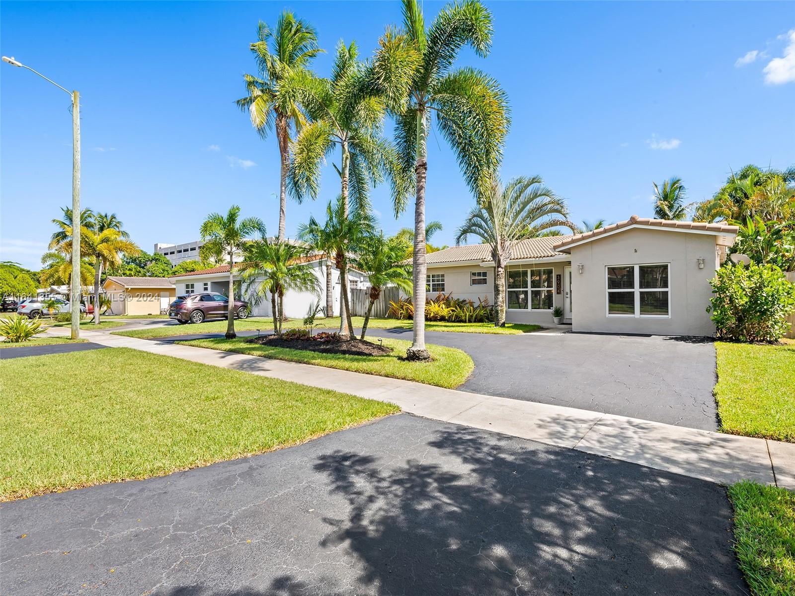 3904 Arthur Street Hollywood, FL 33021 - Photo 2 of 32 a view of outdoor space yard and swimming pool