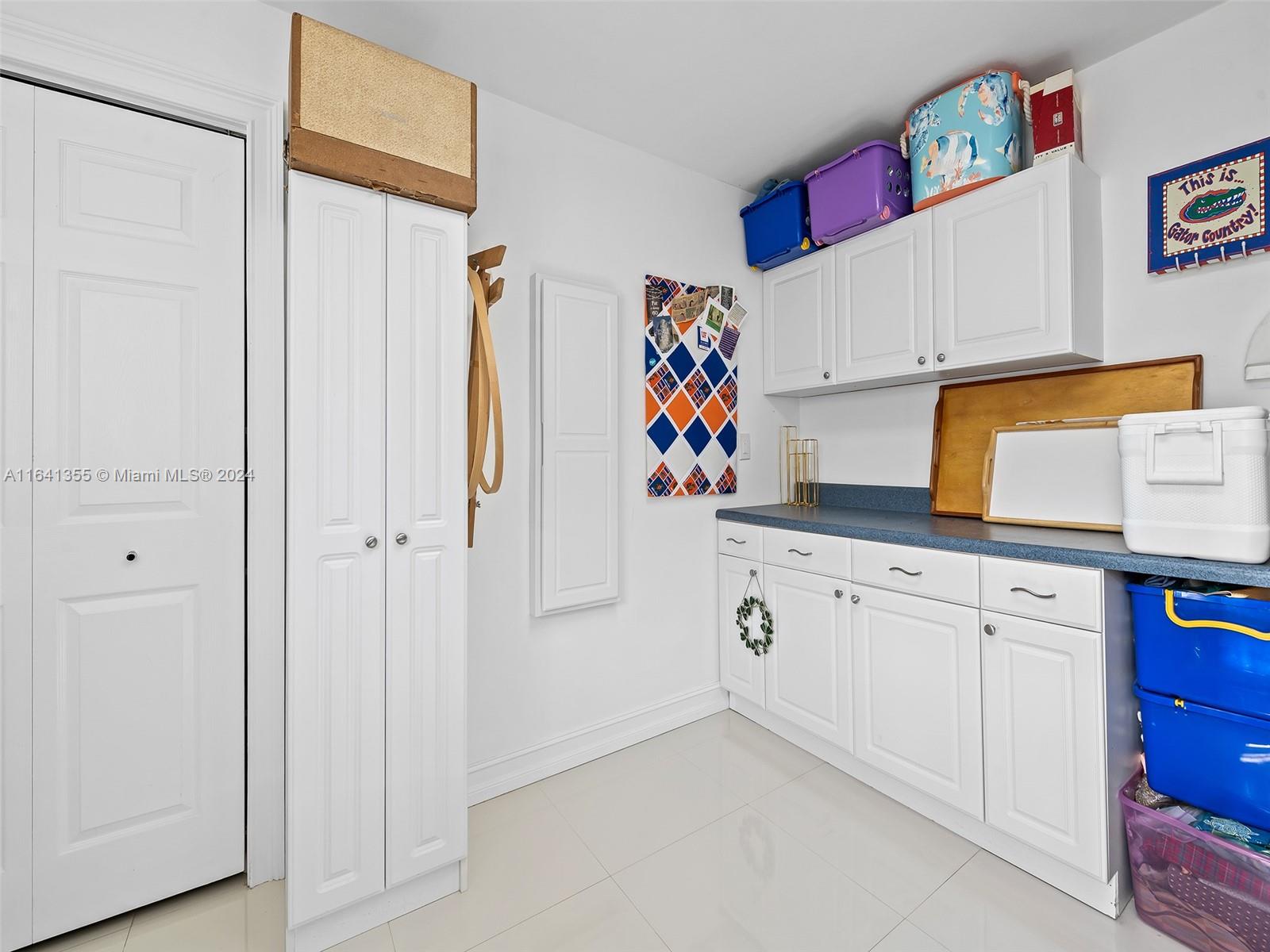 3904 Arthur Street Hollywood, FL 33021 - Photo 21 of 32 a white painted cabinets with wooden floor and cabinets