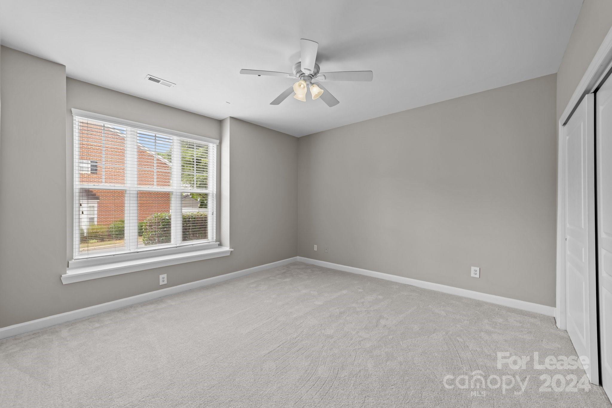 18605 Ruffner Drive, Unit 1C Cornelius, NC 28031 - Photo 13 of 27 an empty room with a window