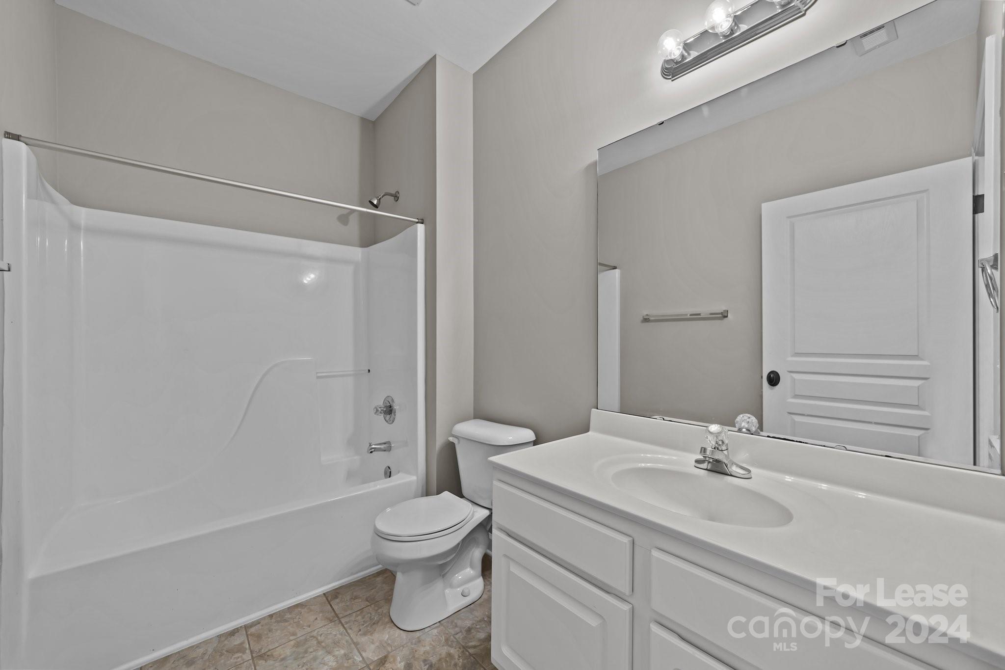 18605 Ruffner Drive, Unit 1C Cornelius, NC 28031 - Photo 18 of 27 a bathroom with a sink toilet tub and shower