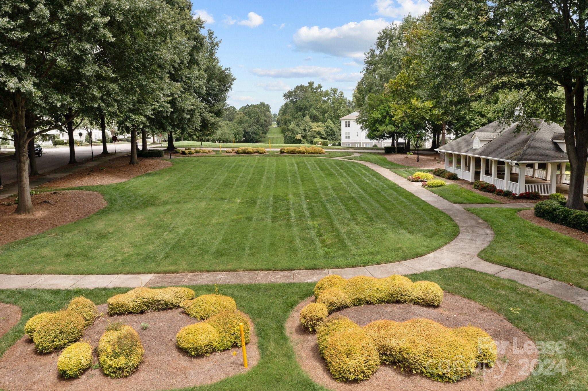 18605 Ruffner Drive, Unit 1C Cornelius, NC 28031 - Photo 23 of 27 a view of swimming pool from a garden