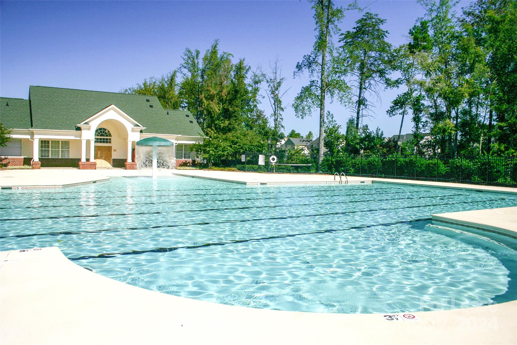 18605 Ruffner Drive, Unit 1C Cornelius, NC 28031 - Photo 25 of 27 a view of a house with a yard