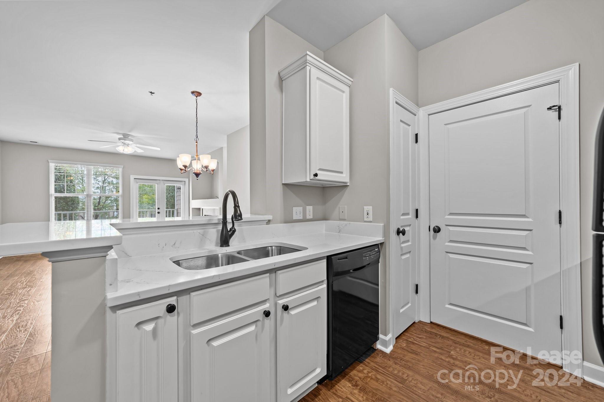 18605 Ruffner Drive, Unit 1C Cornelius, NC 28031 - Photo 10 of 27 a kitchen with a sink and cabinets