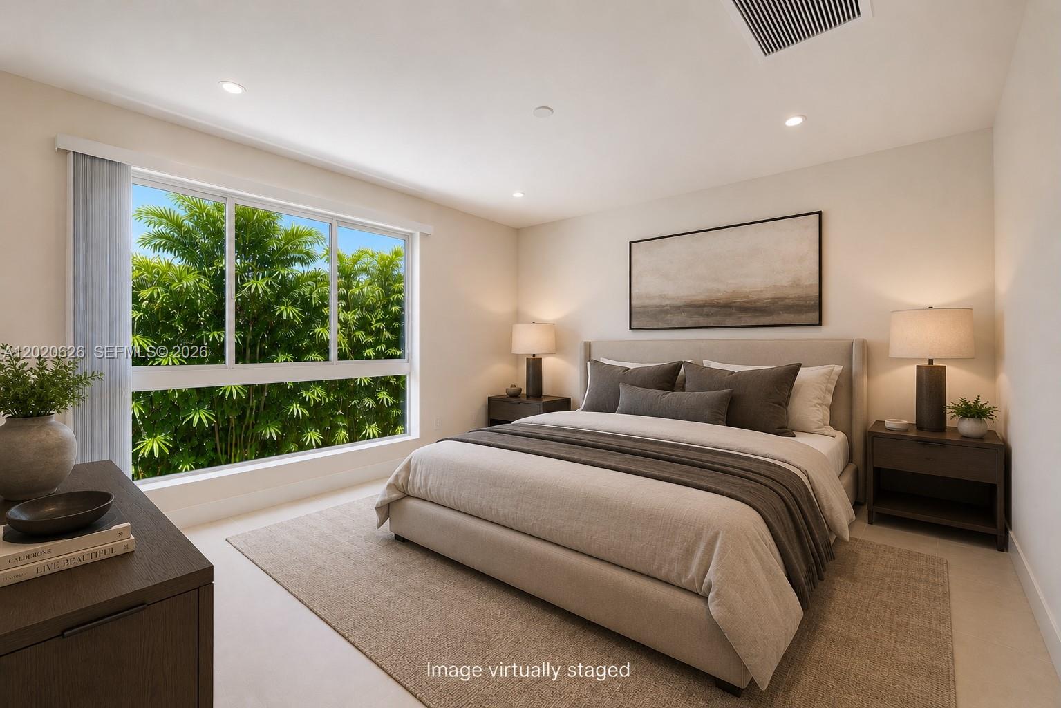 7701 Southwest 95th Terrace, Unit 1 Miami, FL 33156 - Photo 4 of 18 a bedroom with a bed and a large window