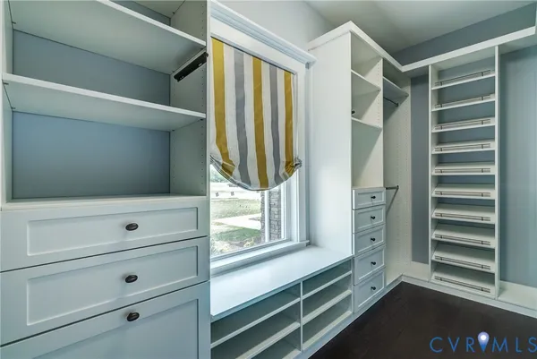 a view of an empty room and closet area