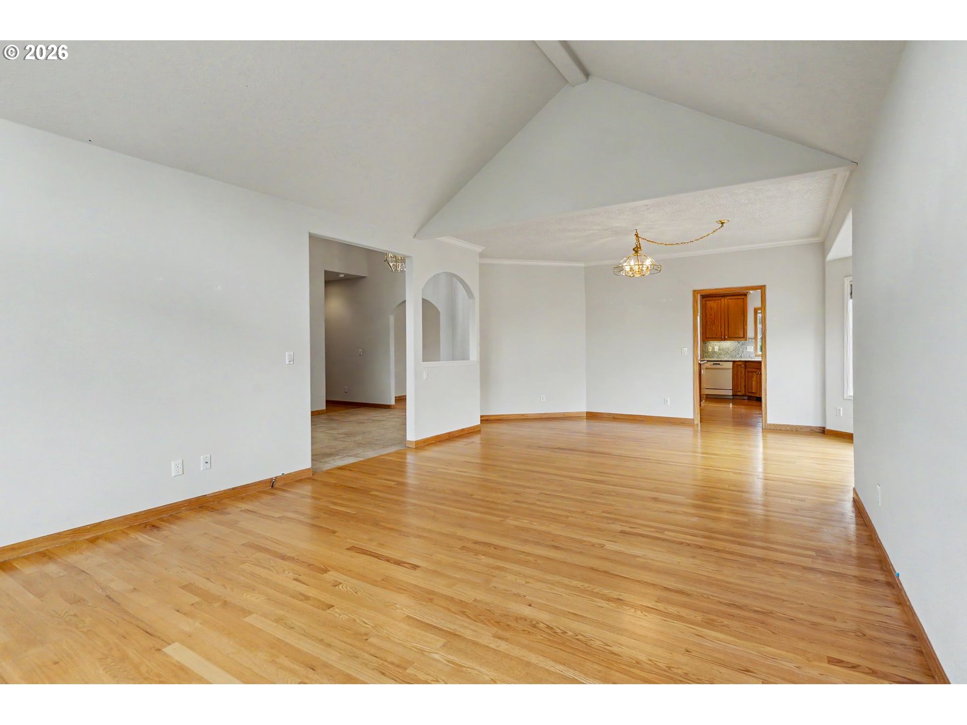 1470 Ranier Loop Northwest Salem, OR 97304 - Photo 10 of 48 a view of an empty room with wooden floor