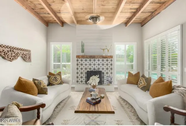 a living room with furniture couches and a fireplace