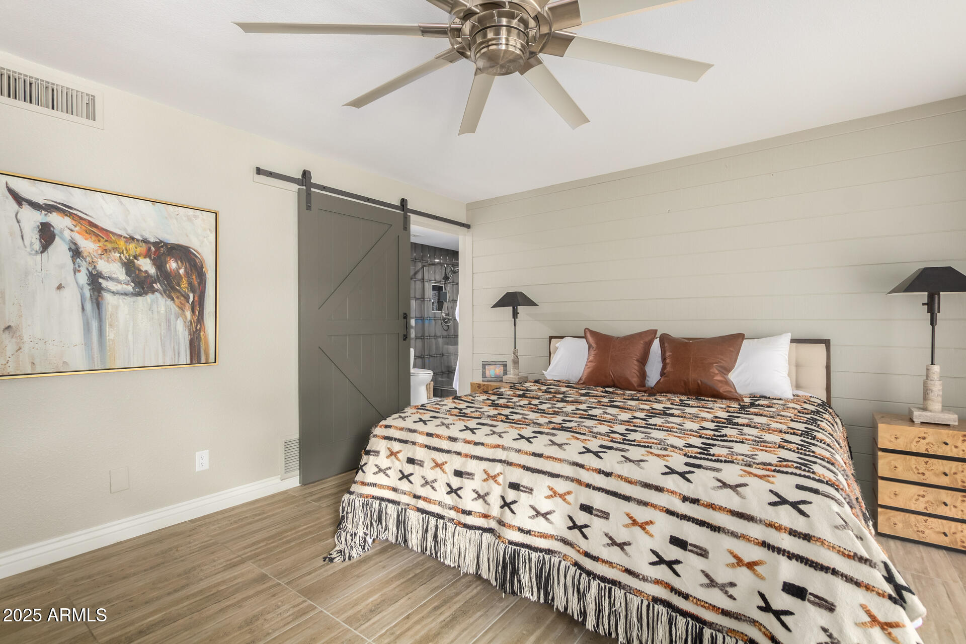 2551 East Missouri Avenue Phoenix, AZ 85016 - Photo 13 of 25 a bedroom with a bed and a chandelier