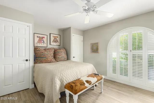 a bedroom with a bed and a window