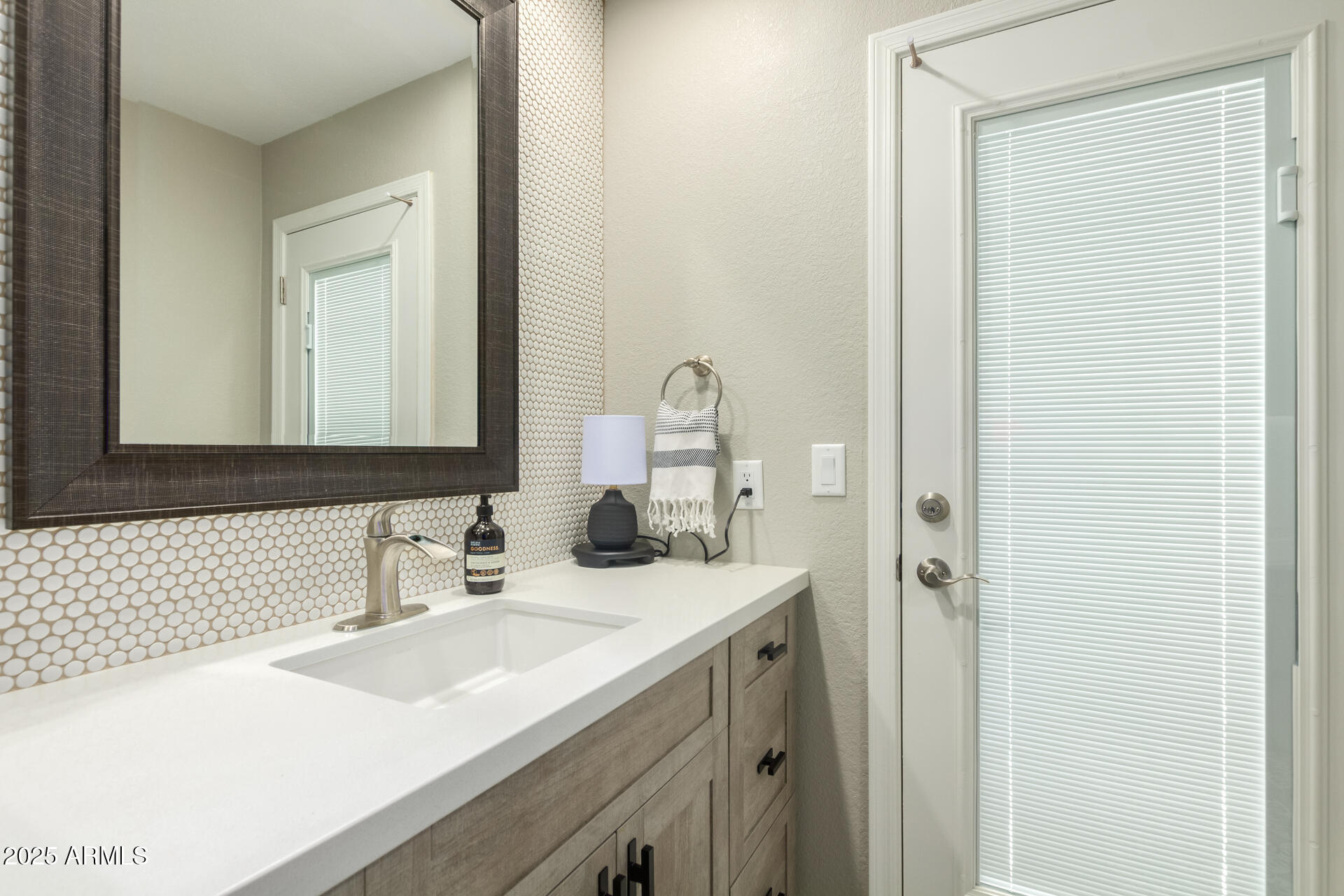 2551 East Missouri Avenue Phoenix, AZ 85016 - Photo 19 of 25 a bathroom with a sink and a mirror