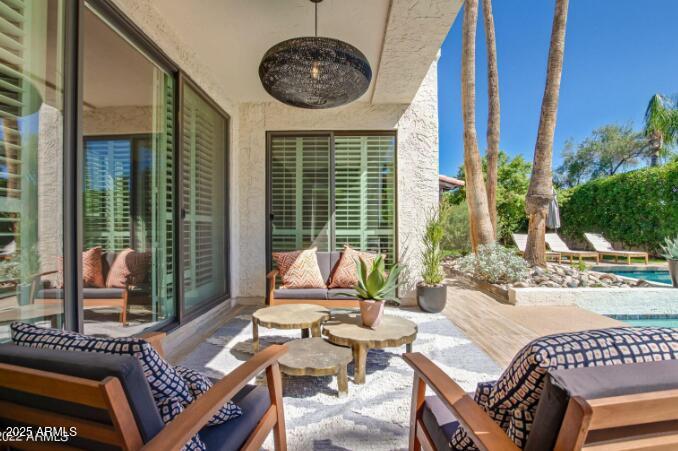 2551 East Missouri Avenue Phoenix, AZ 85016 - Photo 21 of 25 a view of a patio with couches chairs and wooden floor