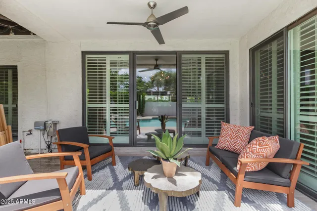 a outdoor living space with furniture and a potted plant