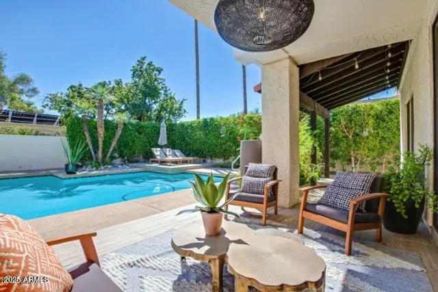 a backyard of a house with outdoor seating