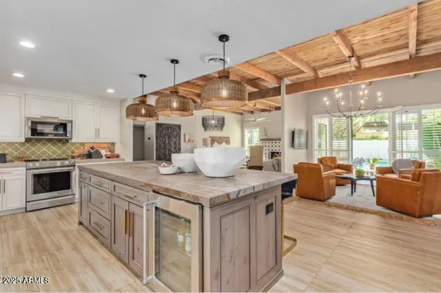 a kitchen with stainless steel appliances granite countertop a stove and cabinets