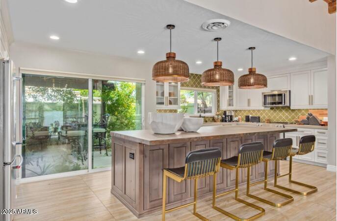 2551 East Missouri Avenue Phoenix, AZ 85016 - Photo 6 of 25 a view of a dining room with furniture window and wooden floor