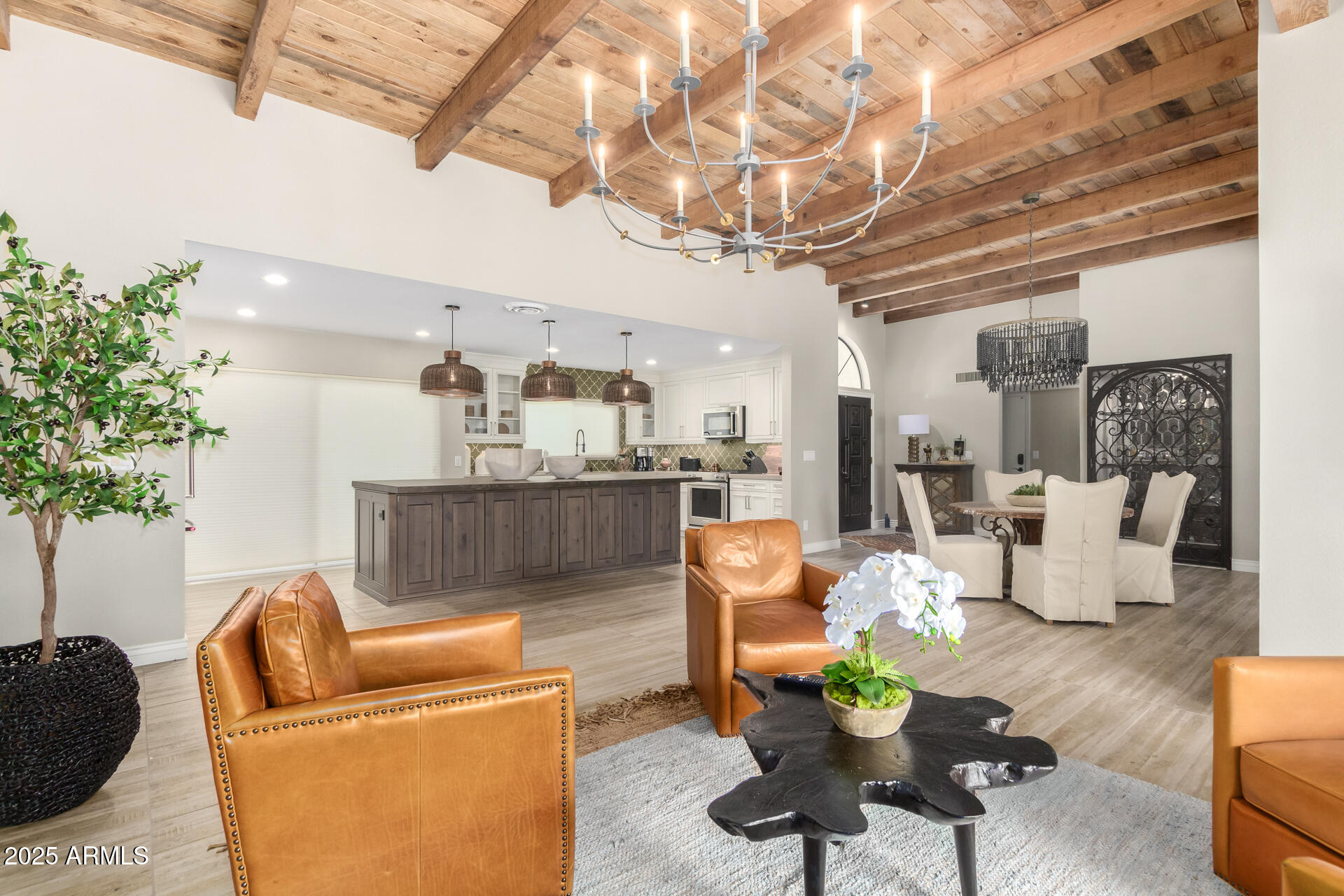 2551 East Missouri Avenue Phoenix, AZ 85016 - Photo 8 of 25 a living room with furniture and a chandelier