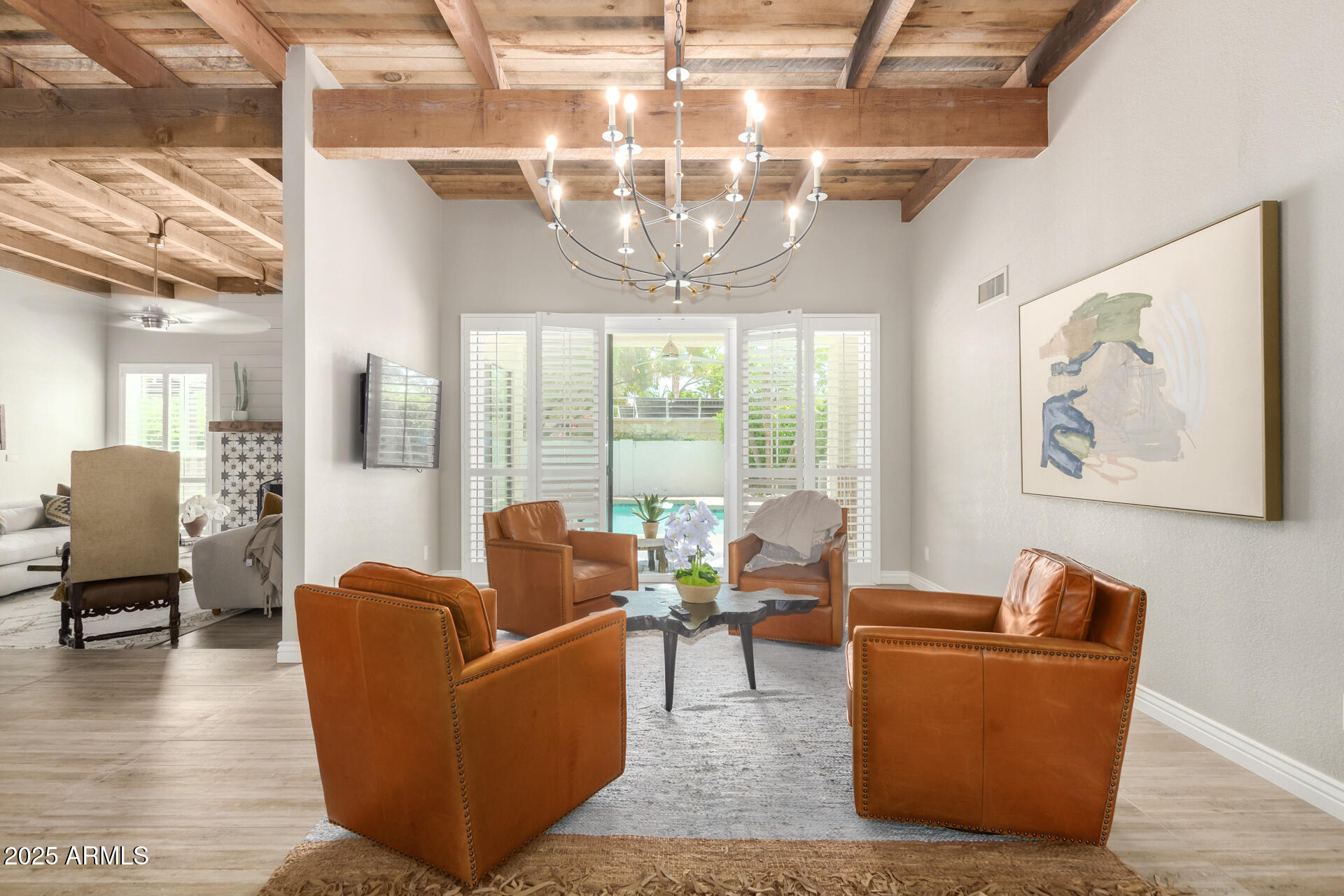 2551 East Missouri Avenue Phoenix, AZ 85016 - Photo 9 of 25 a living room with furniture and a chandelier