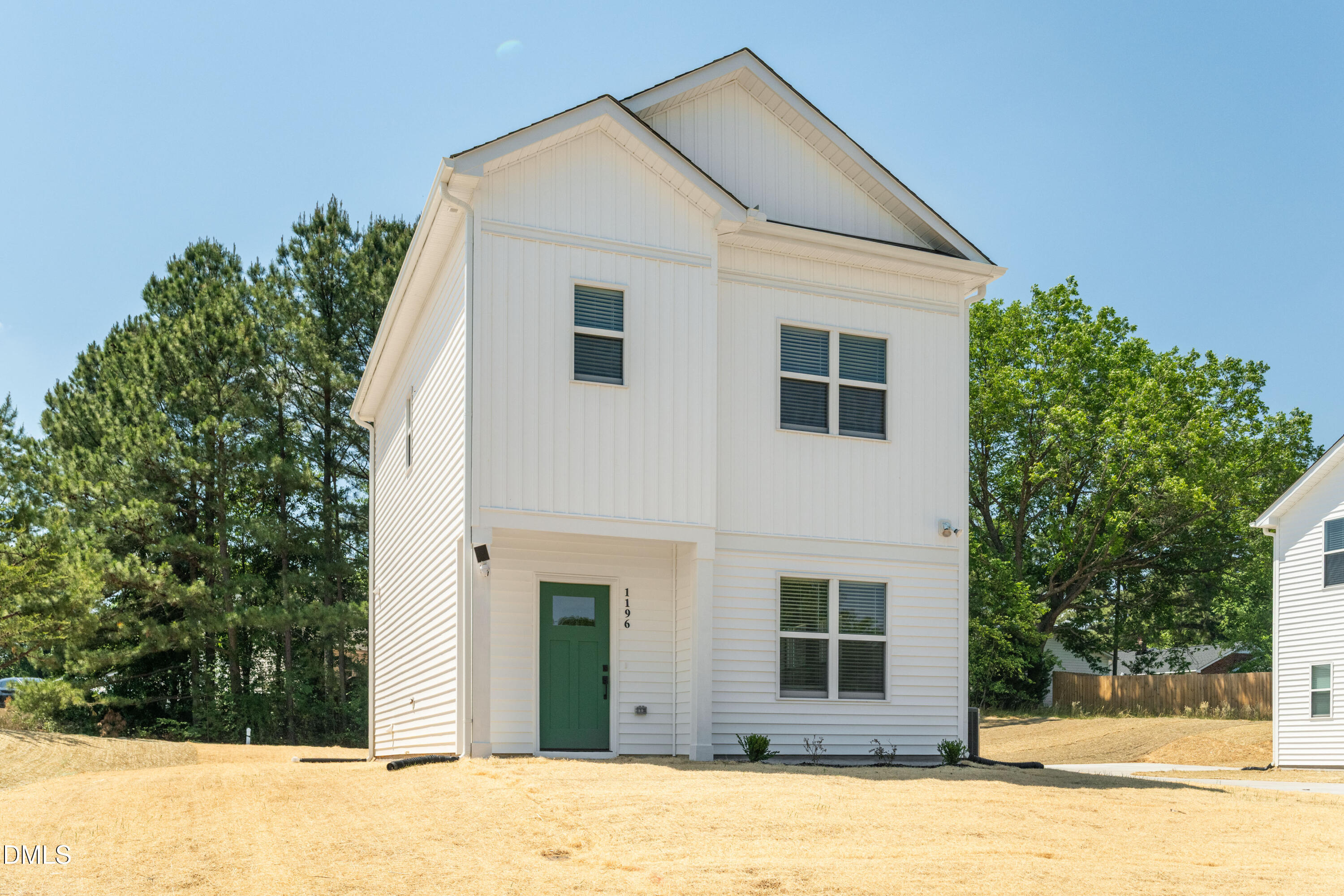 1196 Hurdle Mills Road Roxboro, NC 27573 - Photo 5 of 50 a front view of a house with a yard and garage