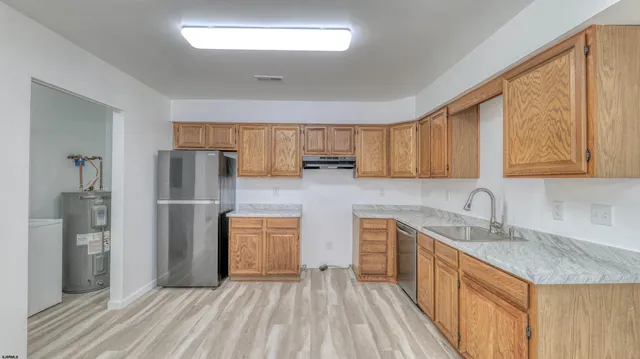 a kitchen with a sink and cabinets
