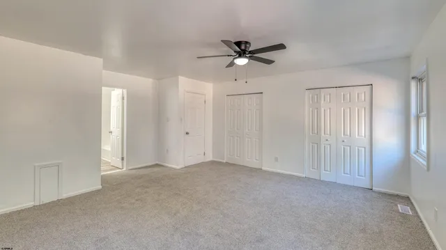a view of a ceiling fan in a room