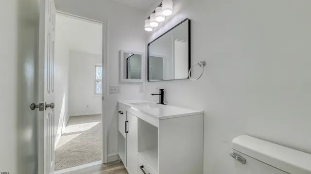 a view of backyard with wooden fence