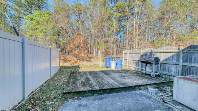 a view of house with a yard